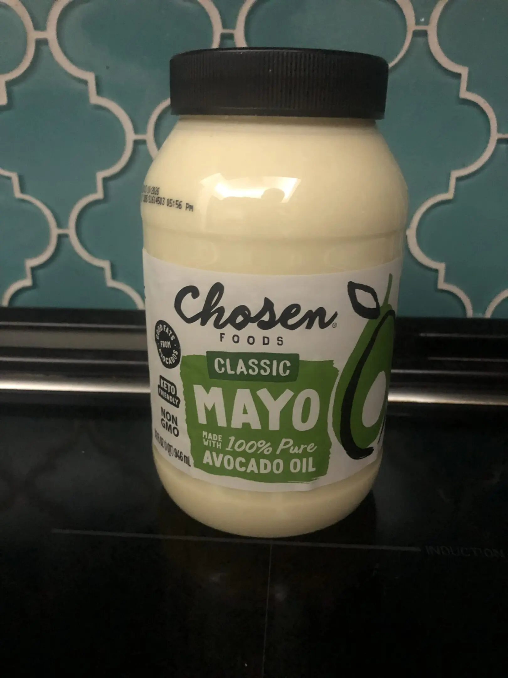 Jar of Chosen Foods avocado oil mayo on a kitchen counter.