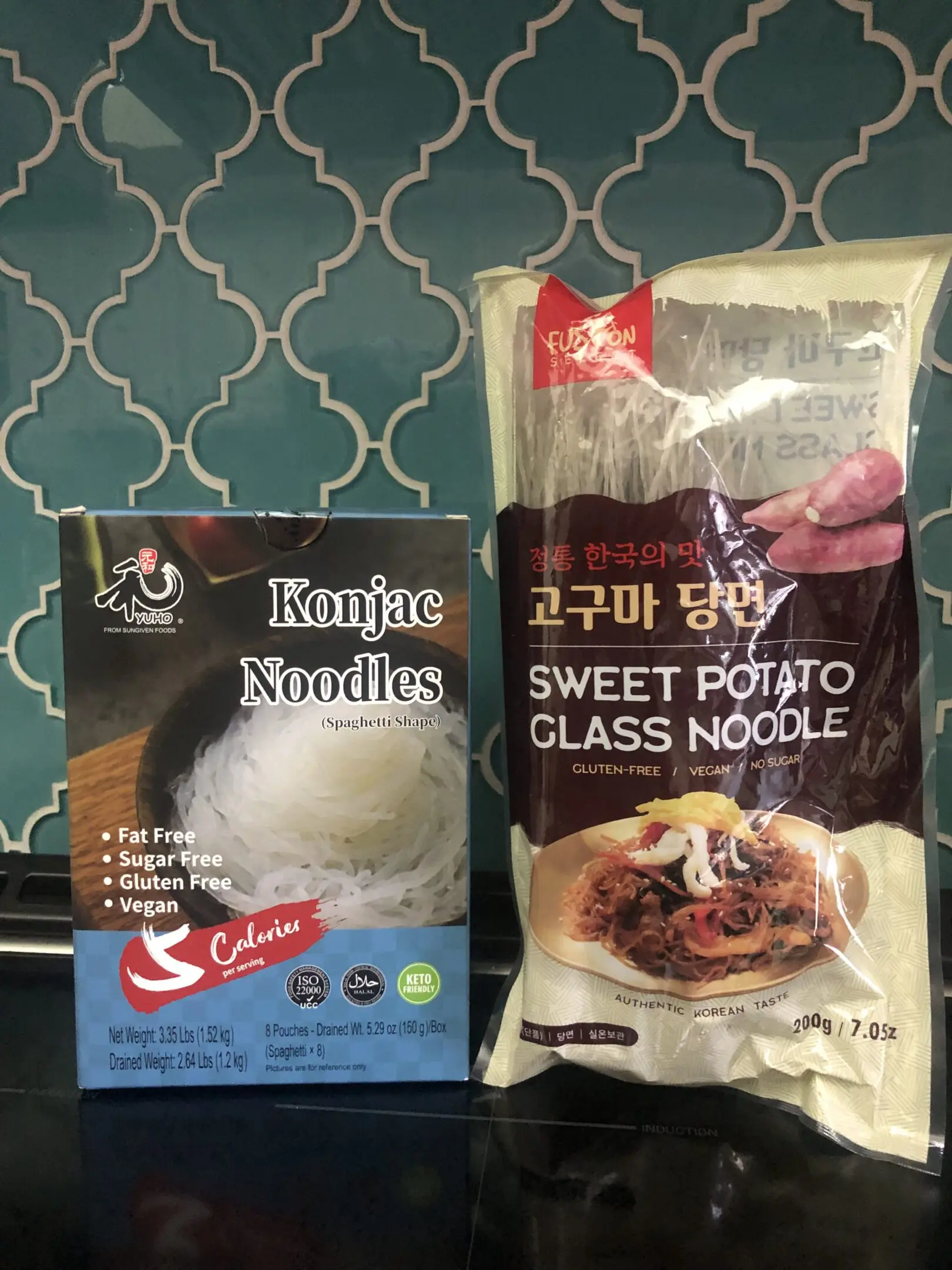 Two packages of Asian glass noodle products on a table.