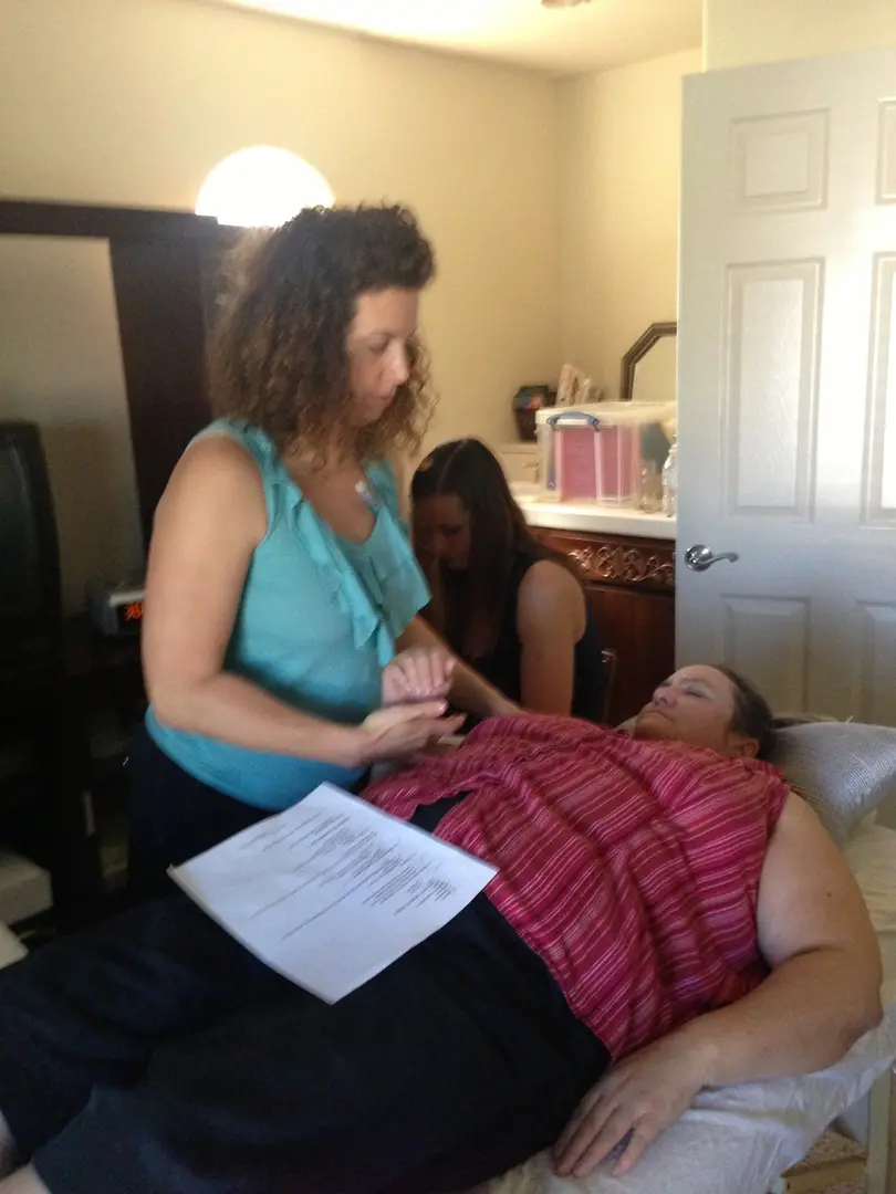 Therapist performing hand massage therapy